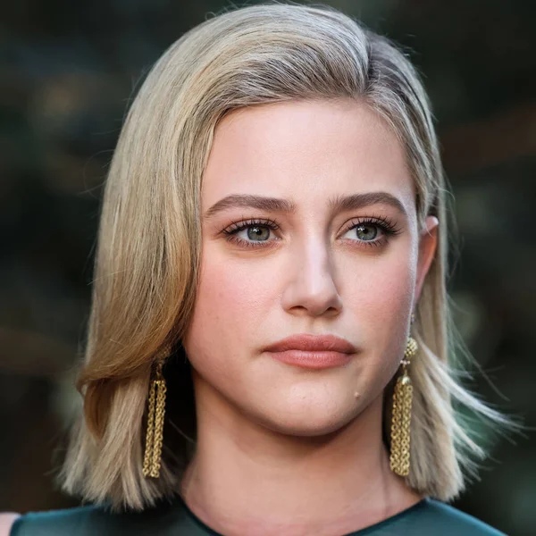 American actress Lili Reinhart wearing Miu Miu arrives at the Los Angeles Premiere Of Netflix's 'Look Both Ways' held at the Netflix Tudum Theater on August 16, 2022 in Hollywood, Los Angeles, California, United States. 