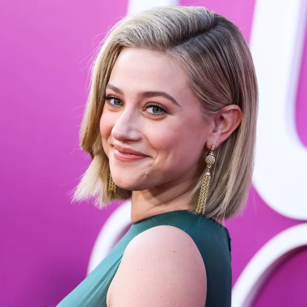 American actress Lili Reinhart wearing Miu Miu is interviewed by Entertainment Tonight (ET) at the Los Angeles Premiere Of Netflix's 'Look Both Ways' held at the Netflix Tudum Theater on August 16, 2022 in Hollywood, Los Angeles, California