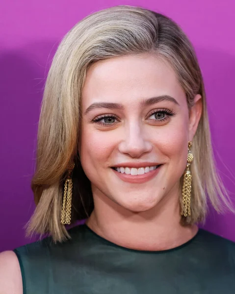 American actress Lili Reinhart wearing Miu Miu arrives at the Los Angeles Premiere Of Netflix's 'Look Both Ways' held at the Netflix Tudum Theater on August 16, 2022 in Hollywood, Los Angeles, California, United States. 