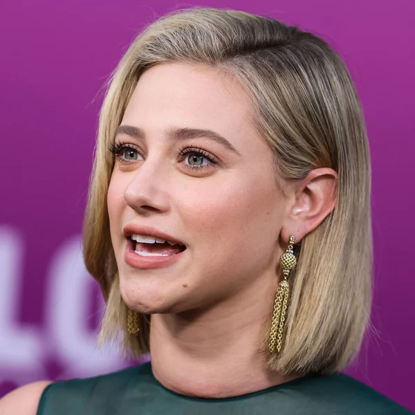 American actress Lili Reinhart wearing Miu Miu arrives at the Los Angeles Premiere Of Netflix's 'Look Both Ways' held at the Netflix Tudum Theater on August 16, 2022 in Hollywood, Los Angeles, California, United States. 