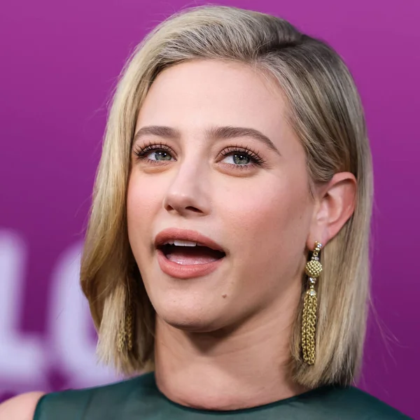American actress Lili Reinhart wearing Miu Miu is interviewed by Entertainment Tonight (ET) at the Los Angeles Premiere Of Netflix's 'Look Both Ways' held at the Netflix Tudum Theater on August 16, 2022 in Hollywood, Los Angeles, California