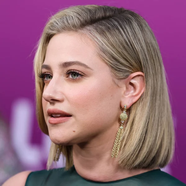 American actress Lili Reinhart wearing Miu Miu arrives at the Los Angeles Premiere Of Netflix's 'Look Both Ways' held at the Netflix Tudum Theater on August 16, 2022 in Hollywood, Los Angeles, California, United States. 