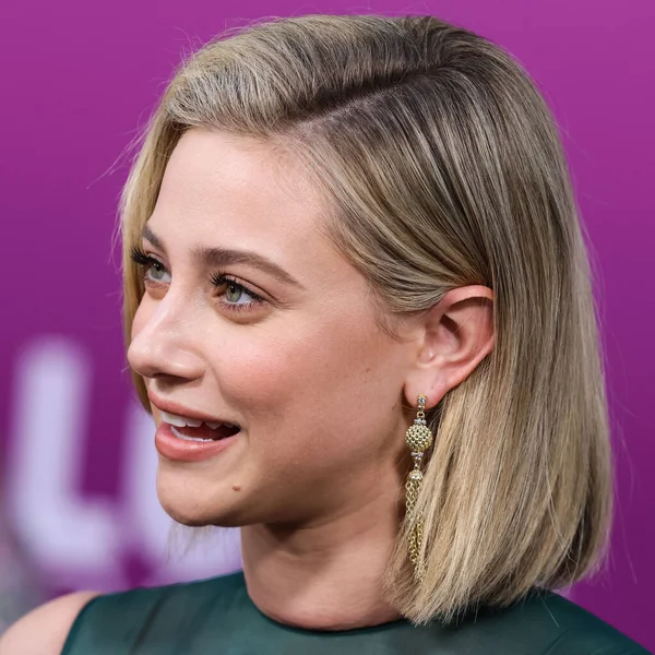 American actress Lili Reinhart wearing Miu Miu arrives at the Los Angeles Premiere Of Netflix's 'Look Both Ways' held at the Netflix Tudum Theater on August 16, 2022 in Hollywood, Los Angeles, California, United States. 