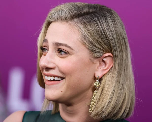 American actress Lili Reinhart wearing Miu Miu is interviewed by Entertainment Tonight (ET) at the Los Angeles Premiere Of Netflix's 'Look Both Ways' held at the Netflix Tudum Theater on August 16, 2022 in Hollywood, Los Angeles, California