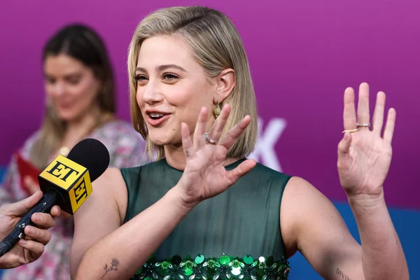 American actress Lili Reinhart wearing Miu Miu is interviewed by Entertainment Tonight (ET) at the Los Angeles Premiere Of Netflix's 'Look Both Ways' held at the Netflix Tudum Theater on August 16, 2022 in Hollywood, Los Angeles, California