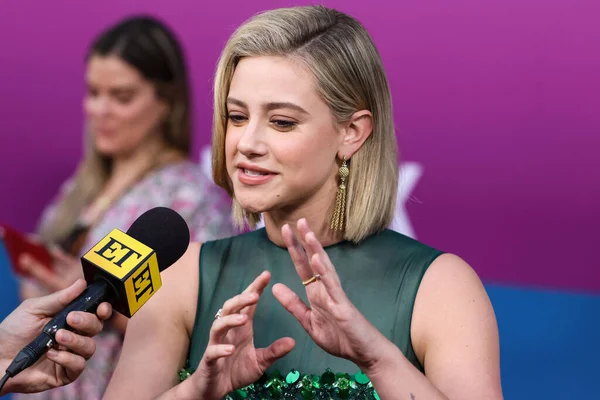 American actress Lili Reinhart wearing Miu Miu is interviewed by Entertainment Tonight (ET) at the Los Angeles Premiere Of Netflix's 'Look Both Ways' held at the Netflix Tudum Theater on August 16, 2022 in Hollywood, Los Angeles, California