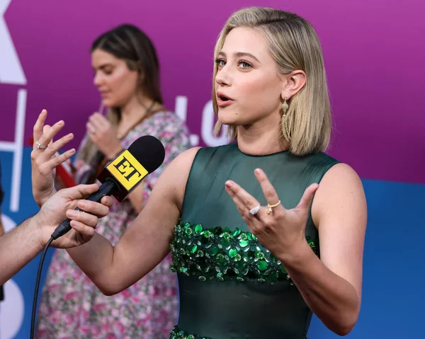 American actress Lili Reinhart wearing Miu Miu is interviewed by Entertainment Tonight (ET) at the Los Angeles Premiere Of Netflix's 'Look Both Ways' held at the Netflix Tudum Theater on August 16, 2022 in Hollywood, Los Angeles, California