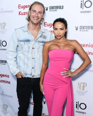 Canadian entrepreneur and Founder of Mindful Media PR Michael Graziano and wife/British YouTuber Natasha Grano Graziano arrive at the Eugenia Kuzmina And Playboy Launch Reception held at The Godfrey Hotel Hollywood on August 18, 2022 in Hollywood
