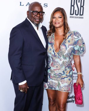 American singer-songwriter Bobby Brown and wife/American television producer Alicia Etheredge arrive at the 22nd Annual Harold And Carole Pump Foundation Gala held at The Beverly Hilton Hotel on August 19, 2022 in Beverly Hills, Los Angeles