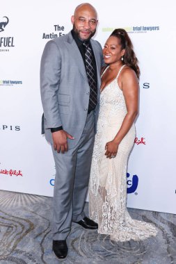 American professional basketball coach and former player who is the head coach of the Los Angeles Lakers of the National Basketball Association Darvin Ham and wife Deneitra Ham arrive at the 22nd Annual Harold And Carole Pump Foundation Gala 