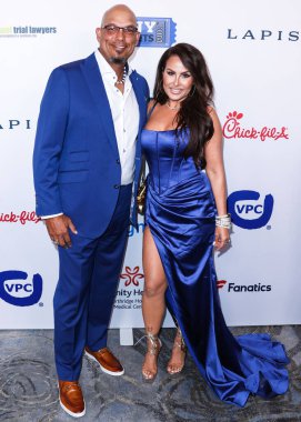 American former professional baseball player David Justice and wife Rebecca Villalobos arrive at the 22nd Annual Harold And Carole Pump Foundation Gala held at The Beverly Hilton Hotel on August 19, 2022 in Beverly Hills, Los Angeles, California