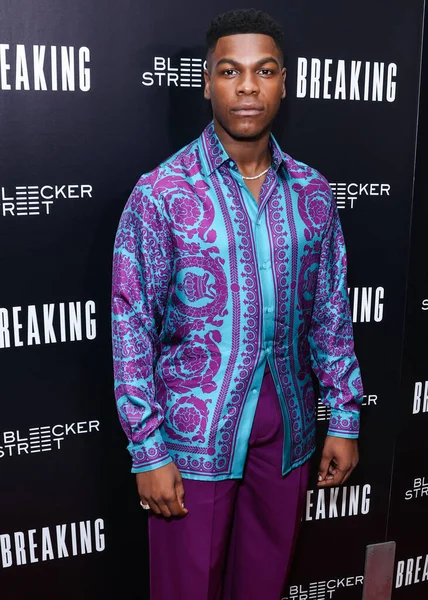 British actor John Boyega arrives at the Los Angeles Special Screening Of Bleecker Street Media's 'Breaking' held at The London Hotel West Hollywood at Beverly Hills on August 24, 2022 in West Hollywood, Los Angeles, California, United States. 