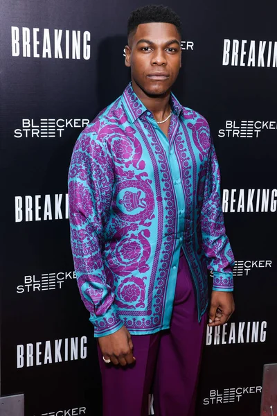 British actor John Boyega arrives at the Los Angeles Special Screening Of Bleecker Street Media's 'Breaking' held at The London Hotel West Hollywood at Beverly Hills on August 24, 2022 in West Hollywood, Los Angeles, California, United States. 