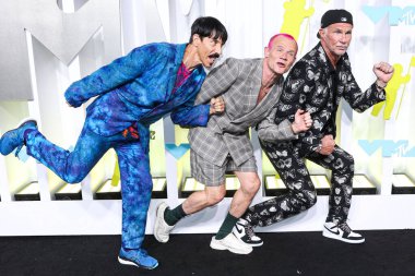 Anthony Kiedis, Flea and Chad Smith of Red Hot Chili Peppers arrive at the 2022 MTV Video Music Awards held at the Prudential Center on August 28, 2022 in Newark, New Jersey, United States.