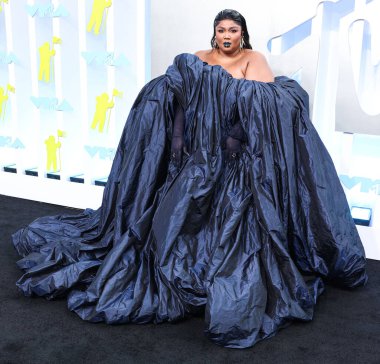 Lizzo wearing a Jean Paul Gaultier Couture dress arrives at the 2022 MTV Video Music Awards held at the Prudential Center on August 28, 2022 in Newark, New Jersey, United States.
