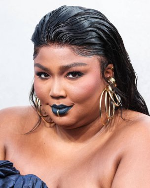 Lizzo wearing a Jean Paul Gaultier Couture dress arrives at the 2022 MTV Video Music Awards held at the Prudential Center on August 28, 2022 in Newark, New Jersey, United States.