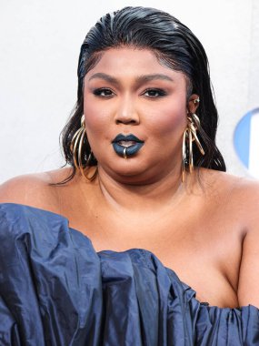 Lizzo wearing a Jean Paul Gaultier Couture dress arrives at the 2022 MTV Video Music Awards held at the Prudential Center on August 28, 2022 in Newark, New Jersey, United States.