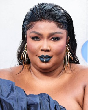 Lizzo wearing a Jean Paul Gaultier Couture dress arrives at the 2022 MTV Video Music Awards held at the Prudential Center on August 28, 2022 in Newark, New Jersey, United States.