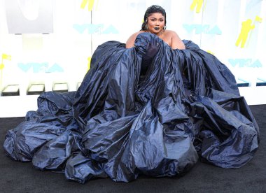 Lizzo wearing a Jean Paul Gaultier Couture dress arrives at the 2022 MTV Video Music Awards held at the Prudential Center on August 28, 2022 in Newark, New Jersey, United States.