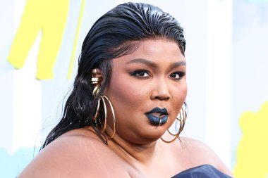 Lizzo wearing a Jean Paul Gaultier Couture dress arrives at the 2022 MTV Video Music Awards held at the Prudential Center on August 28, 2022 in Newark, New Jersey, United States.
