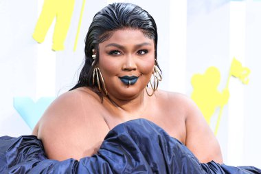 Lizzo wearing a Jean Paul Gaultier Couture dress arrives at the 2022 MTV Video Music Awards held at the Prudential Center on August 28, 2022 in Newark, New Jersey, United States.