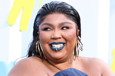 Lizzo wearing a Jean Paul Gaultier Couture dress arrives at the 2022 MTV Video Music Awards held at the Prudential Center on August 28, 2022 in Newark, New Jersey, United States.