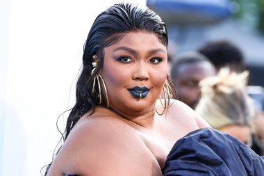 Lizzo wearing a Jean Paul Gaultier Couture dress arrives at the 2022 MTV Video Music Awards held at the Prudential Center on August 28, 2022 in Newark, New Jersey, United States.