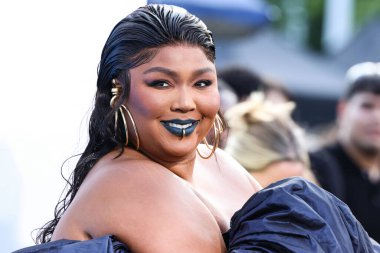 Lizzo wearing a Jean Paul Gaultier Couture dress arrives at the 2022 MTV Video Music Awards held at the Prudential Center on August 28, 2022 in Newark, New Jersey, United States.
