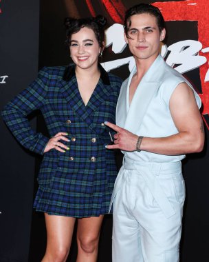 Mary Mouser and Tanner Buchanan arrive at the Los Angeles Premiere Of Netflix's 'Cobra Kai' Season 5 held at the Los Angeles State Historic Park on September 7, 2022 in Los Angeles, California, United States.