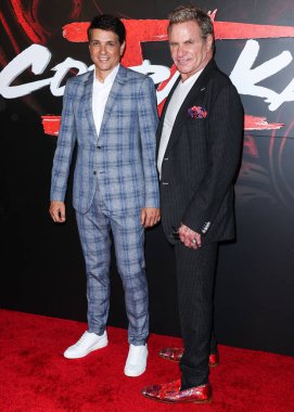 Ralph Macchio and Martin Kove arrive at the Los Angeles Premiere Of Netflix's 'Cobra Kai' Season 5 held at the Los Angeles State Historic Park on September 7, 2022 in Los Angeles, California, United States. 