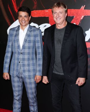 American actors Ralph Macchio and William Zabka arrive at the Los Angeles Premiere Of Netflix's 'Cobra Kai' Season 5 held at the Los Angeles State Historic Park on September 7, 2022 in Los Angeles, California, United States. 