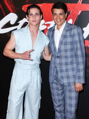 Tanner Buchanan and Ralph Macchio arrive at the Los Angeles Premiere Of Netflix's 'Cobra Kai' Season 5 held at the Los Angeles State Historic Park on September 7, 2022 in Los Angeles, California, United States. 