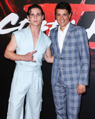 Tanner Buchanan and Ralph Macchio arrive at the Los Angeles Premiere Of Netflix's 'Cobra Kai' Season 5 held at the Los Angeles State Historic Park on September 7, 2022 in Los Angeles, California, United States. 