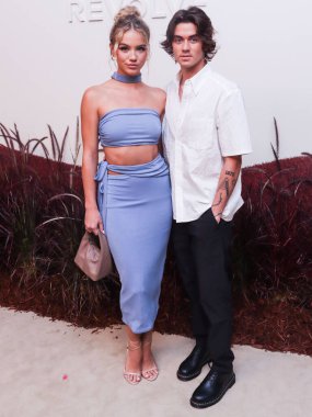 Emma Brooks McAllister and Zack Lugo arrive at the REVOLVE Gallery NYFW (New York Fashion Week) 2022 Presentation VIP Opening Event held at The Shops at Hudson Yards on September 8, 2022 in Manhattan, New York City, New York, United States. clipart
