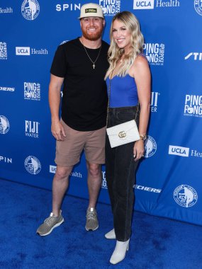 Beyzbol Ligi 'nin Los Angeles Dodgers takımının üçüncü kalecisi Justin Turner ve eşi / Amerikan aktris Kourtney Pogue 8 Ağustos 2022 tarihinde Dodger Stadyumu' nda düzenlenen Kershaw 'un Pong 4 yarışmasına katıldılar. 