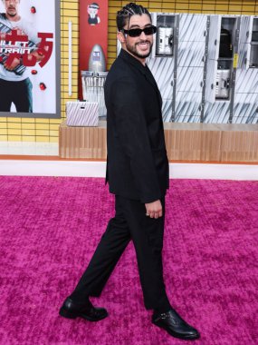 Puerto Rican rapper Bad Bunny (Benito Antonio Martnez Ocasio) wearing a Dior suit arrives at the Los Angeles Premiere Of Sony Pictures' 'Bullet Train' held at the Regency Village Theatre on August 1, 2022 in Westwood, Los Angeles, California