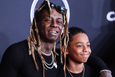 Amerikalı rapçi Lil Wayne (Dwayne Michael Carter Jr.) ve oğlu Kameron Carter, 20 Temmuz 2022 'de Dolby Tiyatrosu' nda düzenlenen 2022 ESPY Ödülleri 'ne geldiler.. 