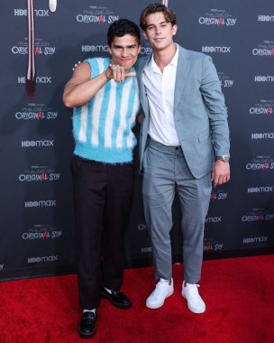 American singer Alex Aiono and American actor Brian Altemus arrive at the Bloody Red Carpet And Exclusive Screening Of HBO Max's 'Pretty Little Liars: Original Sin' held at the SJR Theater at Warner Bros. Studios on July 15, 2022 in Burbank clipart