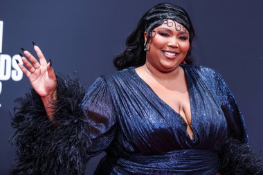 American singer Lizzo wearing a custom Gucci feathered gown arrives at the BET Awards 2022 held at Microsoft Theater at L.A. Live on June 26, 2022 in Los Angeles, California, United States