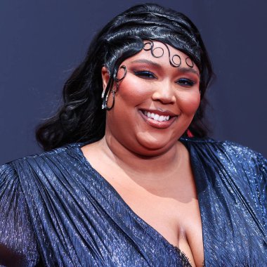 American singer Lizzo wearing a custom Gucci feathered gown arrives at the BET Awards 2022 held at Microsoft Theater at L.A. Live on June 26, 2022 in Los Angeles, California, United States.