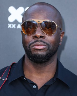 Haitili rapçi Wyclef Jean, 11 Haziran 2022 'de Universal Studios Backlot' ta düzenlenen Charlize Theron Africa Yardım Projesine (CTAOP) ulaştı.. 