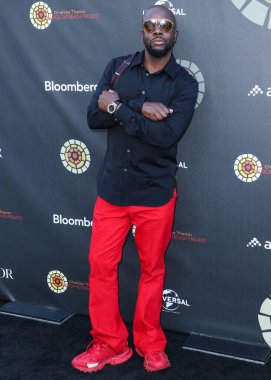 Haitili rapçi Wyclef Jean, 11 Haziran 2022 'de Universal Studios Backlot' ta düzenlenen Charlize Theron Africa Yardım Projesine (CTAOP) ulaştı.. 