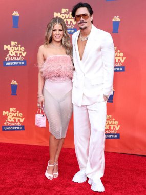 In this image released on June 5, American actress Ariana Madix and actor Tom Sandoval arrive at the 2022 MTV Movie And TV Awards: UNSCRIPTED held at The Barker Hangar in Santa Monica, Los Angeles, California, United States.  clipart