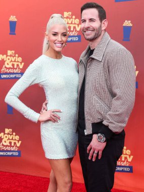 5 Haziran 'da yayınlanan bu resimde, Amerikalı aktris Heather Rae Young El Moussa ve koca / Amerikan TV kişiliği Tarek El Moussa 2022 MTV Film ve TV Ödülleri' ne geldiler: Los Angeles, Santa Monica 'daki Barker Hangarında UNSCRIPTED düzenlendi.
