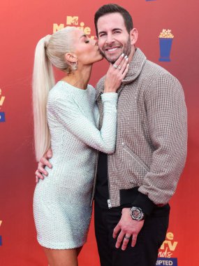 5 Haziran 'da yayınlanan bu resimde, Amerikalı aktris Heather Rae Young El Moussa ve koca / Amerikan TV kişiliği Tarek El Moussa 2022 MTV Film ve TV Ödülleri' ne geldiler: Los Angeles, Santa Monica 'daki Barker Hangarında UNSCRIPTED düzenlendi.