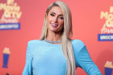 5 Haziran 'da yayınlanan bu resimde, Amerikan medya kişiliği Paris Hilton 2022 MTV Film ve TV Ödülleri' ne ulaştı: Santa Monica, Los Angeles, Kaliforniya, ABD 'deki Barker Hangar' da UNSCRIPTED. 