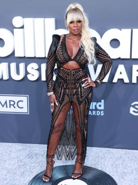 Julien Macdonald 'ı giyen Amerikalı şarkıcı / oyuncu Mary J. Blige, 15 Mayıs 2022' de ABD 'nin Las Vegas, Nevada kentindeki MGM Grand Garden Arena' da düzenlenen 2022 Billboard Müzik Ödüllerine ulaştı.. 