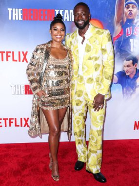 Valentino giyen Amerikalı aktris Gabrielle Union ve Gucci giyen Amerikalı eski profesyonel basketbolcu Dwyane Wade Netflix 'in Netflix' in 'The Redeem Team' adlı Netflix Tudum Theater 'daki özel gösterimine geldiler.