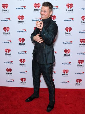 The Miz, 23 Eylül 2022 'de Las Vegas, Nevada' da T-Mobile Arena 'da düzenlenen iHeartRadio Music Festival' de basın odasında poz verdi.. 