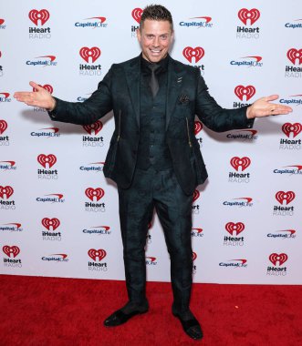 The Miz, 23 Eylül 2022 'de Las Vegas, Nevada' da T-Mobile Arena 'da düzenlenen iHeartRadio Music Festival' de basın odasında poz verdi.. 